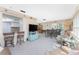 Open concept living area with a breakfast bar, dining set, and cozy seating arrangement at 146 Rotonda Cir, Rotonda West, FL 33947