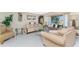 Cozy living room with tile floors, neutral decor, and plenty of space for furniture at 146 Rotonda Cir, Rotonda West, FL 33947