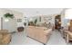 Bright and airy living room with tile flooring and ample seating perfect for entertaining at 146 Rotonda Cir, Rotonda West, FL 33947