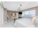 Spacious main bedroom showcases tile floors, comfortable bed, and a bright window with light-filtering curtains at 146 Rotonda Cir, Rotonda West, FL 33947