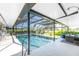 Lovely screened-in pool area with seating, providing the perfect space for relaxation and outdoor enjoyment at 146 Rotonda Cir, Rotonda West, FL 33947