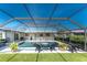 Inviting screened-in pool area with a lounge chairs, perfect for enjoying sunny days and relaxing by the pool at 146 Rotonda Cir, Rotonda West, FL 33947