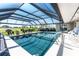 Inviting screened-in pool with golf course views, perfect for relaxation and recreation at 146 Rotonda Cir, Rotonda West, FL 33947
