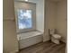 Bathroom features a large soaking tub and bright window at 15417 Hanley Ct, Port Charlotte, FL 33953
