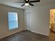 Bright bedroom featuring luxury vinyl floors, a window, and a closet at 15417 Hanley Ct, Port Charlotte, FL 33953