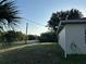 This home features a well-maintained lawn, a stucco exterior, and mature landscaping for privacy at 15417 Hanley Ct, Port Charlotte, FL 33953