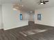 Open floor plan with wood-look floors, lots of windows, and recessed lighting at 15417 Hanley Ct, Port Charlotte, FL 33953