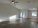 Spacious living room with wood-look floors, high ceilings, and lots of natural light at 15417 Hanley Ct, Port Charlotte, FL 33953