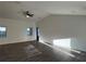 Open-concept living room features wood-look floors, high ceilings, and recessed lighting at 15417 Hanley Ct, Port Charlotte, FL 33953