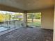 Screened lanai with brick flooring, showing the pool and outdoor access at 15417 Hanley Ct, Port Charlotte, FL 33953