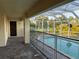 Screened-in lanai with brick flooring around a fenced in pool, perfect for outdoor entertaining at 15417 Hanley Ct, Port Charlotte, FL 33953