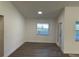 Bright room with wood-look flooring and natural light, perfect for dining or office space at 15417 Hanley Ct, Port Charlotte, FL 33953
