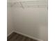 Bright walk-in closet featuring wire shelving for optimal storage solutions at 15417 Hanley Ct, Port Charlotte, FL 33953