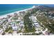 Panoramic aerial view of coastal neighborhood with beach access and waterfront homes at 180 N Gulf Blvd # 5, Placida, FL 33946