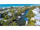 A beautiful aerial view of the coastline with waterfront homes, private boat docks, and winding canals at 180 N Gulf Blvd # 5, Placida, FL 33946