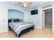 Comfortable bedroom with queen bed, mounted TV, and en suite bathroom. Freshly painted at 180 N Gulf Blvd # 5, Placida, FL 33946