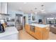 Modern kitchen features stainless steel appliances, marble countertops, and an island with storage at 180 N Gulf Blvd # 5, Placida, FL 33946