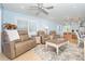 Stylish living room with comfortable seating, recessed lighting, and an adjacent open kitchen at 180 N Gulf Blvd # 5, Placida, FL 33946