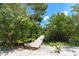 Inviting boardwalk through lush greenery leads to the house at 180 N Gulf Blvd # 5, Placida, FL 33946