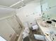 Bathroom featuring shower, sink, toilet, and vanity at 22589 Nyack Ave, Port Charlotte, FL 33952