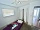 Bedroom featuring a window, ceiling fan, and closet at 22589 Nyack Ave, Port Charlotte, FL 33952