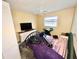 Bedroom featuring a window, ceiling fan, and closet at 22589 Nyack Ave, Port Charlotte, FL 33952
