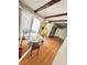 Dining room with glass table and black iron chairs, featuring exposed beams at 22589 Nyack Ave, Port Charlotte, FL 33952
