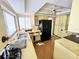 Outdated kitchen with yellow cabinets and black appliances, featuring a double sink at 22589 Nyack Ave, Port Charlotte, FL 33952