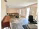 A living room featuring a couch, window, and tile flooring at 22589 Nyack Ave, Port Charlotte, FL 33952