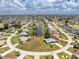 Aerial view of property highlighting its location on a waterfront lot in a residential community at 23 Bunker Cir, Rotonda West, FL 33947