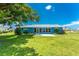 A spacious backyard and patio highlight this home's outdoor living potential at 23 Bunker Cir, Rotonda West, FL 33947