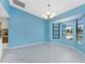 Bright dining room featuring a bay window, chandelier, and light blue walls at 23 Bunker Cir, Rotonda West, FL 33947