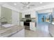 Stylish kitchen featuring stainless steel appliances and marble countertops at 23 Bunker Cir, Rotonda West, FL 33947