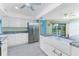 Kitchen with stainless steel refrigerator and double farmhouse style sink at 23 Bunker Cir, Rotonda West, FL 33947