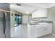 Updated kitchen with granite counters, stainless steel appliances and a pantry at 23 Bunker Cir, Rotonda West, FL 33947