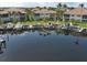 Aerial view showcasing waterfront condos with boat docks, offering stunning marina and residential views at 2590 Tarpon Cove Dr # 811, Punta Gorda, FL 33950