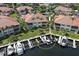 Aerial view showing waterfront condos with boat docks, highlighting the community's access to water activities at 2590 Tarpon Cove Dr # 811, Punta Gorda, FL 33950
