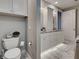 Bright bathroom featuring dual sinks, white cabinetry, granite countertops, and marble-tiled floors at 2590 Tarpon Cove Dr # 811, Punta Gorda, FL 33950