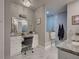 Bathroom featuring a vanity with double sinks, a makeup vanity, and a tiled walk-in shower at 2590 Tarpon Cove Dr # 811, Punta Gorda, FL 33950