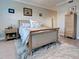Bedroom with wood look floors, area rug, and an upholstered bed with a light blue comforter at 2590 Tarpon Cove Dr # 811, Punta Gorda, FL 33950