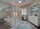 Cozy bedroom featuring a bunk bed, desk, shuttered window, and decorative shelves at 2590 Tarpon Cove Dr # 811, Punta Gorda, FL 33950