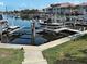Scenic shot of a boat lift at a dock, showcasing waterfront property with convenient boat storage at 2590 Tarpon Cove Dr # 811, Punta Gorda, FL 33950