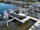 Close-up view of a boat lift system, highlighting its functionality and convenience for boat owners at 2590 Tarpon Cove Dr # 811, Punta Gorda, FL 33950