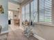 View of the dining area showcasing a stylish serving cart with a view to the kitchen at 2590 Tarpon Cove Dr # 811, Punta Gorda, FL 33950