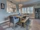 Open concept dining area with stylish seating, chandelier lighting, and a seamless flow to the kitchen at 2590 Tarpon Cove Dr # 811, Punta Gorda, FL 33950