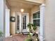 Close up of a charming front entrance, featuring french doors and detailed trim at 2590 Tarpon Cove Dr # 811, Punta Gorda, FL 33950
