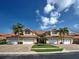 Charming townhomes featuring red tile roofs, lush landscaping, and inviting driveways at 2590 Tarpon Cove Dr # 811, Punta Gorda, FL 33950