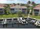 Waterfront property featuring a private boat dock with lush landscaping in a serene waterfront community at 2590 Tarpon Cove Dr # 811, Punta Gorda, FL 33950