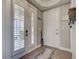 Bright foyer with hardwood floors, large doors, and natural light at 2590 Tarpon Cove Dr # 811, Punta Gorda, FL 33950