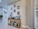 Hallway features decoratively displayed photos and is illuminated by natural light at 2590 Tarpon Cove Dr # 811, Punta Gorda, FL 33950